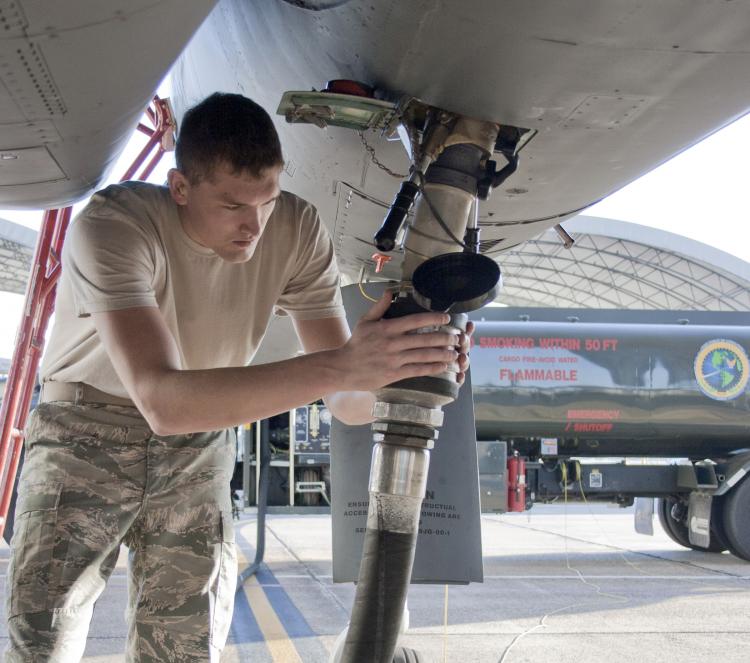Senior Airman Jacob Prine checks the fuel connection to a F-15 Eagle on Oct. 22, 2010, prior to a flight test of new, environmentally-friendly fuel. The Air Force is working toward changing half of the continental U.S. jet fuel requirement to alternative  (U.S. Air Force photo/2nd Lt. Andrew Caulk)