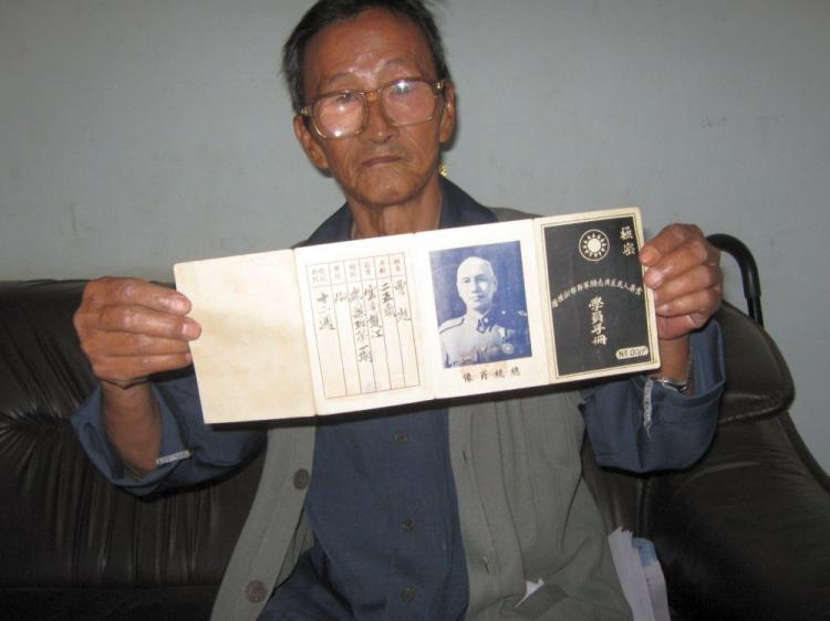 Cao Wen Biao, a former officer of the Kuomintang's 'lost army,' displays his student identification from a Nationalist university, which he attended before Mao Zedong's communists took control of mainland China. The image in the centre of his ID is of Nationalist leader Chiang Kai-shek. (John Zhang/The Epoch Times )