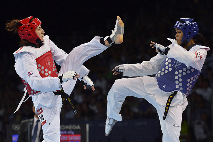 US athlete Paige Mcpherson (blue) fights Paige McPherson (blue) fights against Great Britain's Sarah Stevenson during their women's 67 kg taekwondo bout in the London 2012 Olympic Games. (Alberto Pizzoli/AFP/GettyImages)
