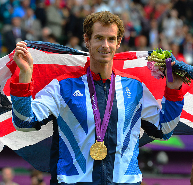 Great Britain's Andy Murray poses with h Great Britain's Andy Murray poses with his gold medal at the end of the men's singles tennis tournament of the London 2012 Olympic Games. (Luis Acosta/AFP/GettyImages)