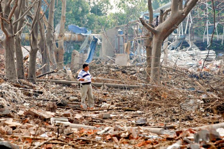 RUBBLE: A man stands among what's left of the buildings shattered by the explosion in Nanjing City, Jiangsu Province. (The Epoch Times)