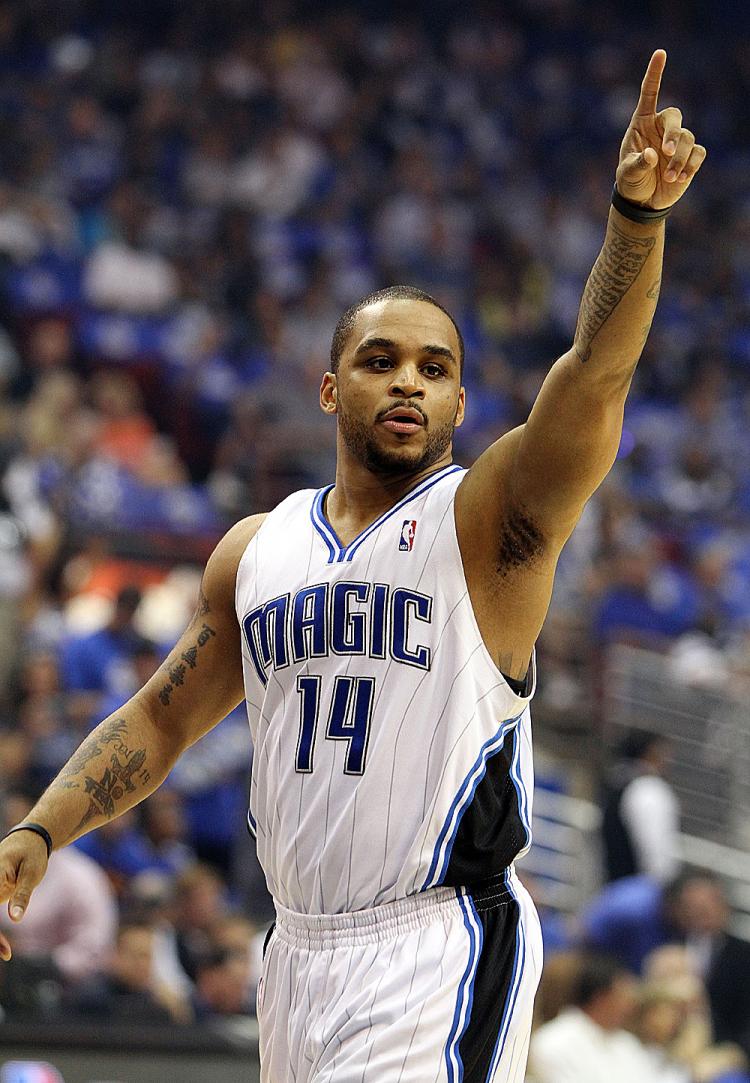 GOOD START: Orlando's Jameer Nelson and Dwight Howard delivered a huge one-two punch to the Atlanta Hawks on Tuesday night. (Doug Benc/Getty Images)