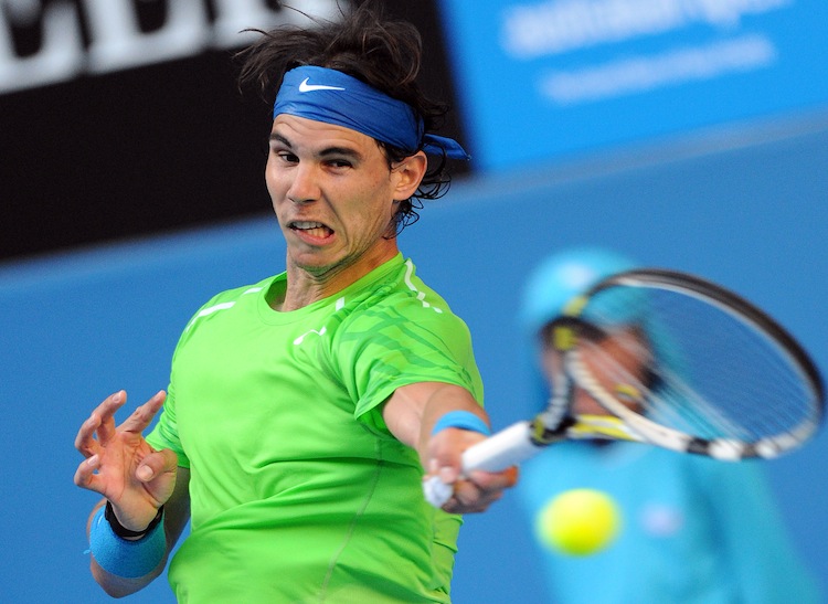 Rafael Nadal of Spain hits a return agai