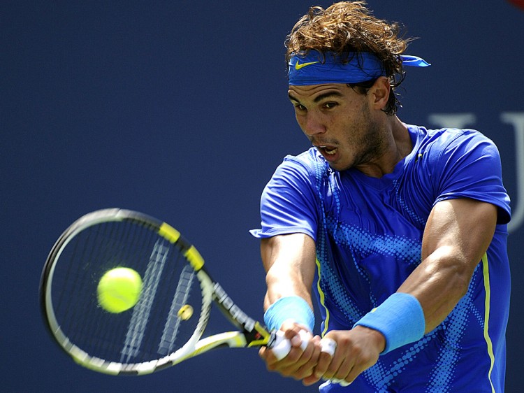 Rafael Nadal hits a backhand against Gilles Muller during their Men's singles US Open match at the USTA Billie Jean King National Tennis Center in Flushing, New York. (Timothy A. Clary/AFP/Getty Images)