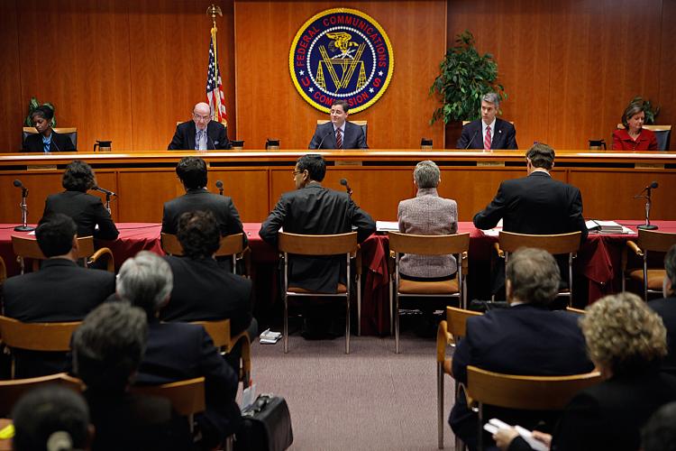FCC Commissioners (L-R) Mignon Clyburn, Michael Copps, Chairman Julius Genachowski, Robert McDowell and Meredith Attwell Baker deliver opening remarks before voting 3-2 to adopted controversial Net neutrality rules. (Chip Somodevilla/Getty Images) FCC Commissioners (L-R) Mignon Clyburn, Michael Copps, Chairman Julius Genachowski, Robert McDowell and Meredith Attwell Baker deliver opening remarks before voting 3-2 to adopted controversial Net neutrality rules. (Chip Somodevilla/Getty Images)