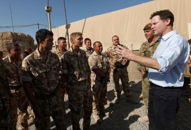 British Deputy Prime Minister Nick Clegg (R), speaks to soldiers during his visit to Shawquat Forward Operating Base in Afghanistan on August 31, 2010. (Andrew Winning/AFP/Getty Images)