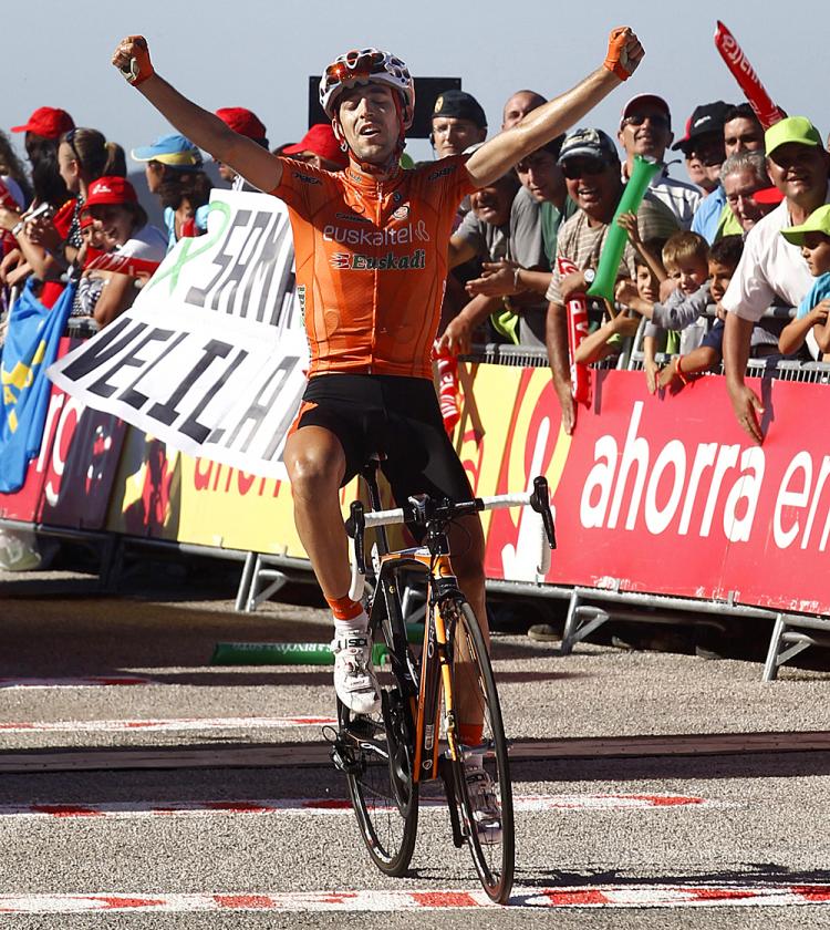 Mikel Nieve of Euskaltel-Euskadi team crosses the finish line of Stage Six of the Vuelta a España, his first Grand Tour victory. (Jaime Reina/AFP/Getty Images)