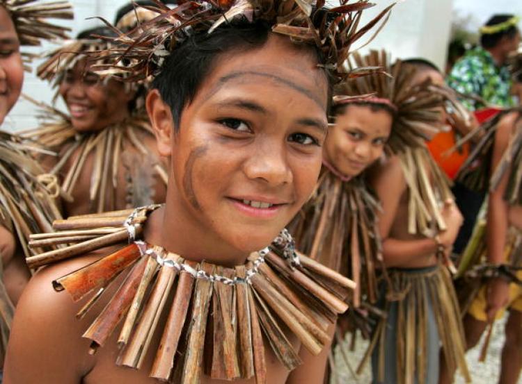 A local Niuean boy is attracted by the camera as dancers prepare for a visiting dignitary. The Rudd Government has made it clear that the Pacific is now a priority, a University of Technology researcher says.  (Sandra Teddy/Getty Images)