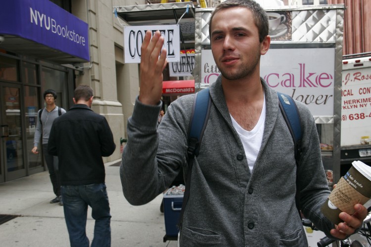 Noam Tomachoff spontaneously preforming a scene from Macbeth on the street. (Gidon Belmaker/The Epoch Times)