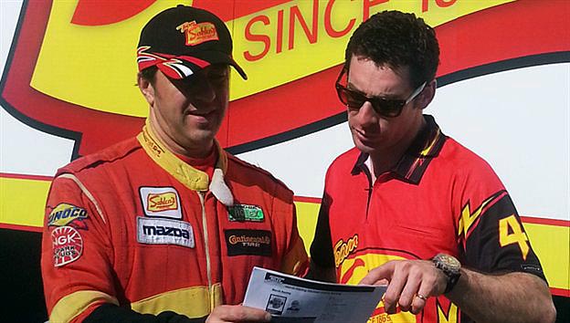 Simon Pagenaud (R) studies data with Wayne Nonnemaker outside the Team Sahlen's hauler. (Grand-Am.com)