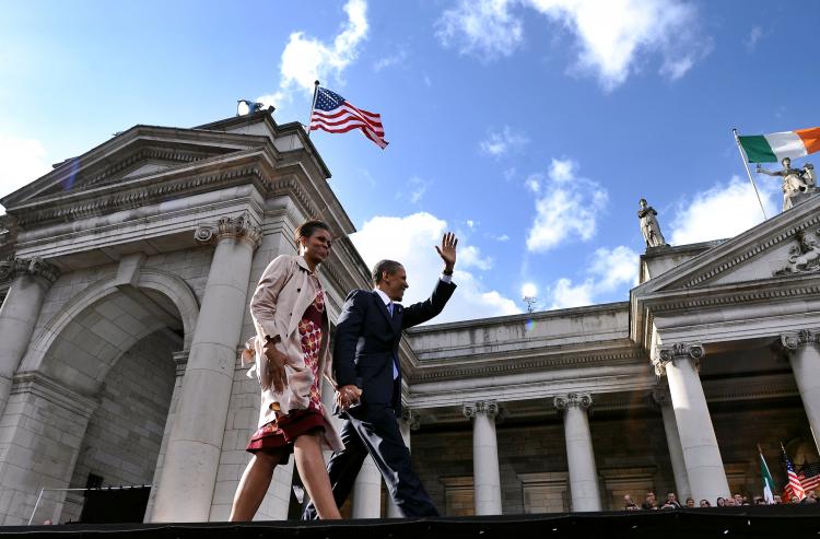 President Barack Obama (R) and first lady Michelle Obama arrive on stage to join an Irish celebration at Green College in Dublin on May 23. The visit to Ireland is the first stop on Obama's week-long European tour which will also take in Britain, a G-8 summit in France, and Poland. (Jewel Samad/AFP/Getty Images)