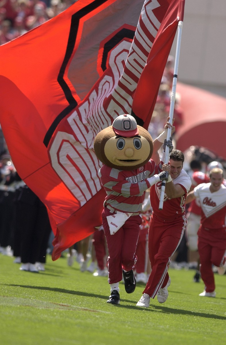 Brutus helps carry the flag