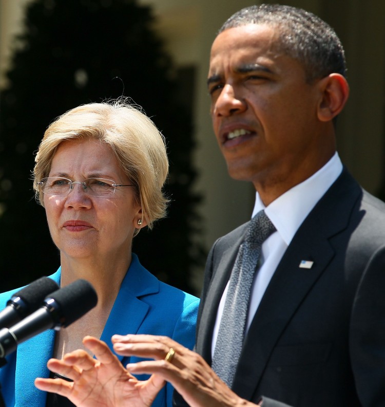 CONSUMER AGENCY: President Barack Obama speaks during a press conference while special adviser on the Consumer Financial Protection Bureau Elizabeth Warren listens at the White House July 18.  (Mark Wilson/Getty Images )