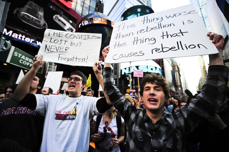 Occupy Wall Street participants stage a protest on Times Square in New York on Oct. 15. (Emmanuel Dunand/Getty Images)