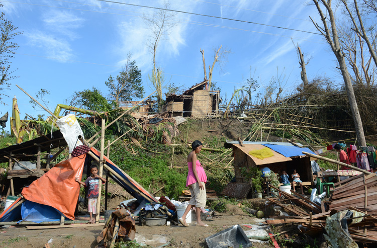  Residents rest at their makeshift homes in Montevista town, Compostel
