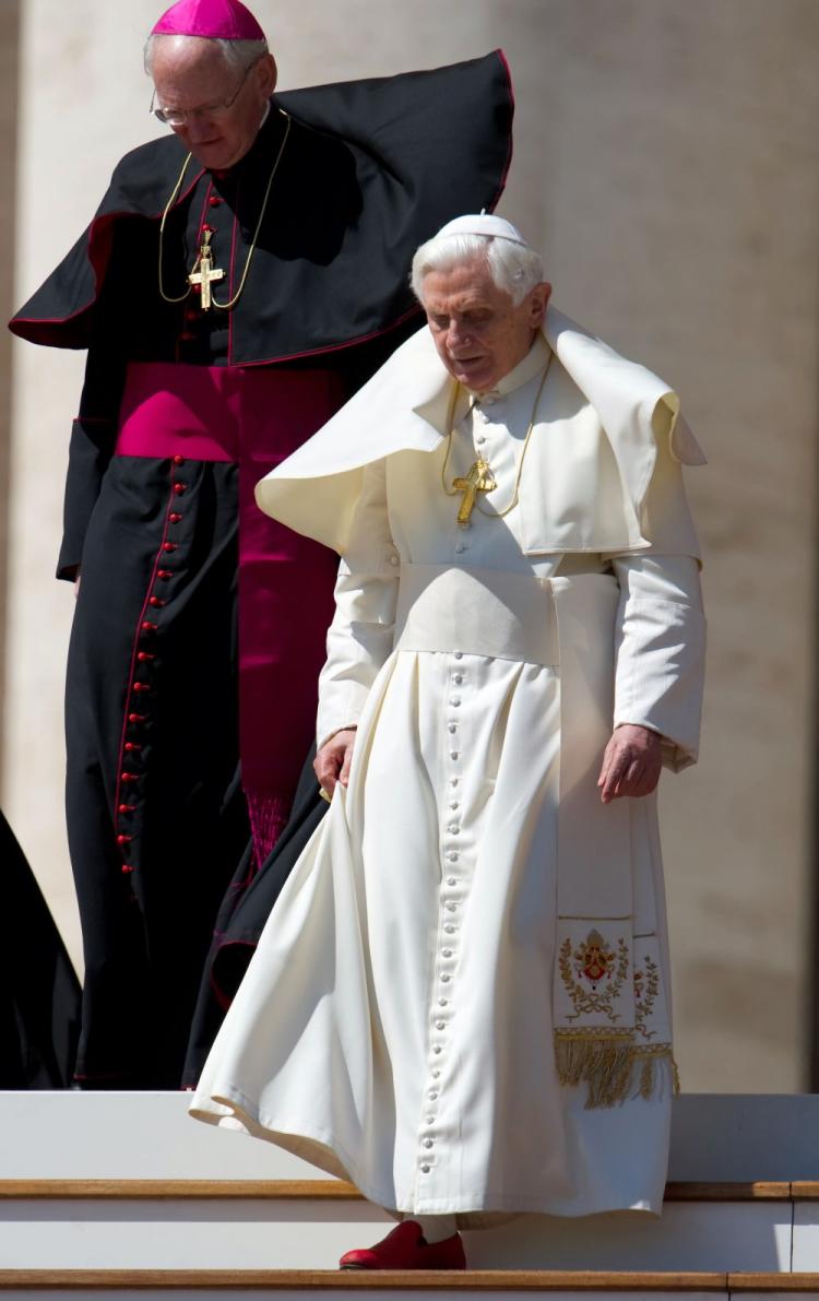 Pope Benedict XVI (R) walks during his weekly general audience on April 7 at the Vatican. The pontiff acknowledged two days before that the Roman Catholic Church is in ''times of difficulty'' but avoided direct comment on sex abuse, as the Vatican faced fresh criticism over the scandal. (Vincenzo Pinto/AFP/Getty Image )