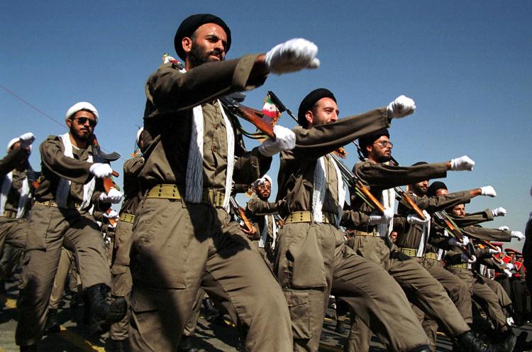 Armed Iranian mullahs (Shiite clerics) march during a military parade in Tehran marking the 20th anniversary of the war with Iraq. (Atta Kenare/AFP/Getty Images)