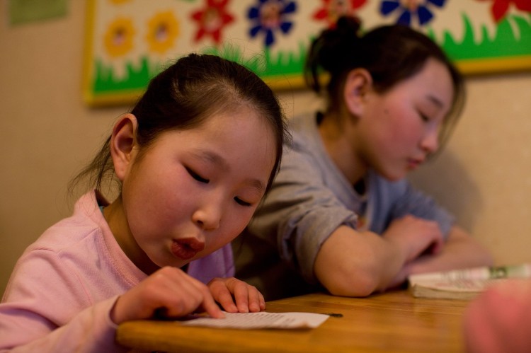 CARE & SUPPORT: Whether you encourage the child with positive acceptance or challenging pushes, always let the child know someone is paying attention and cares. (Paula Bronstein/Getty Images)