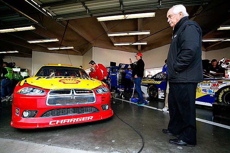 Team owner Roger Penske looks at the 22 Shell/Pennzoil Dodge of A.J. Allmendinger in the garage during practice for the NASCAR Sprint Cup Series Daytona 500. (Tyler Barrick/Getty Images for NASCAR)