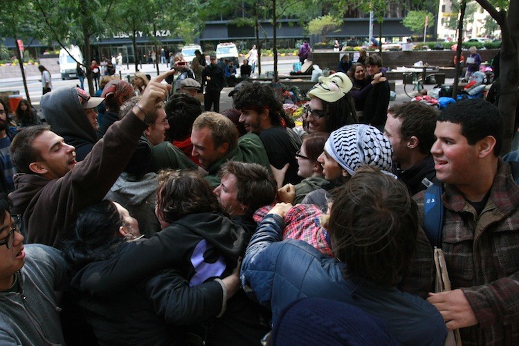 Protesters practice a crowd game called 'Protect Your People,' designed to teach a group to protect those singled out for arrest, at the Zucotti Park in the Financial District on Sunday. (Ivan Pentchoukov/The Epoch Times)