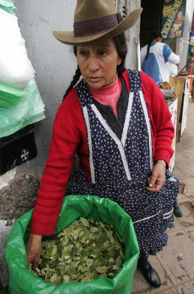 An andean peasant woman sells coca leaves in a market in the andean city of Cuzco. Leaves are used for infussions and the traditional chewing but most of coca production is raw material for cocaine. (Eitan Abramovich/AFP/Getty Images)