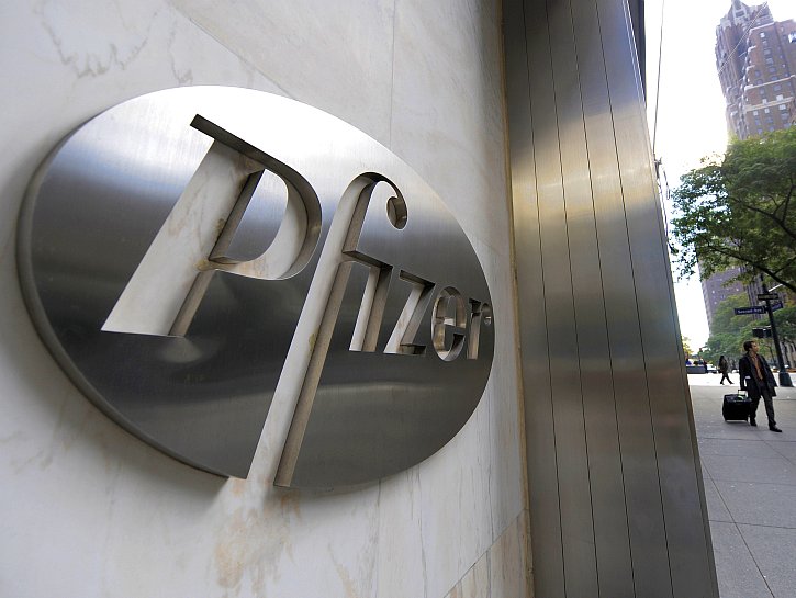 Pharmaceutical company Pfizer is displayed on 42 Street in New York. Pfizer Inc. on Tuesday announced that it would shut down 8 plants around the world, slashing 6,000 total jobs in its ffort to cut down on payroll expense.  (Timothy A. Clary/Getty Images)