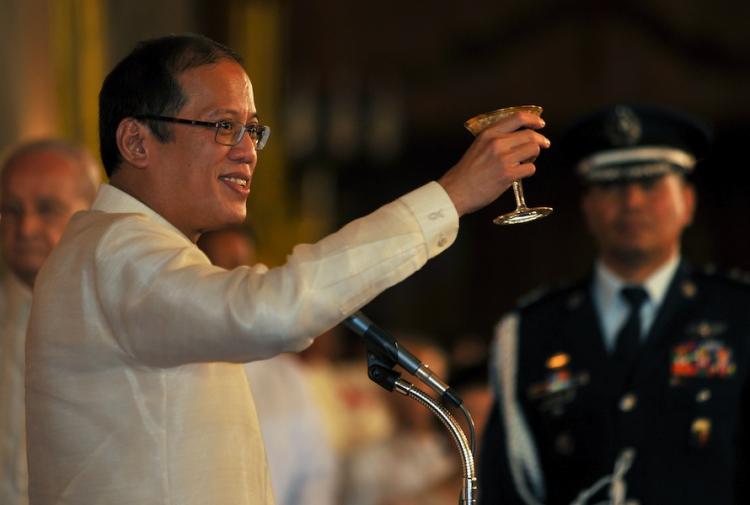 Newly inaugurated Philippine President Benigno Aquino offers a toast during the inaugural reception at the Malacanang Palace in Manila on June 30.   (Noel Celis/Getty Images)