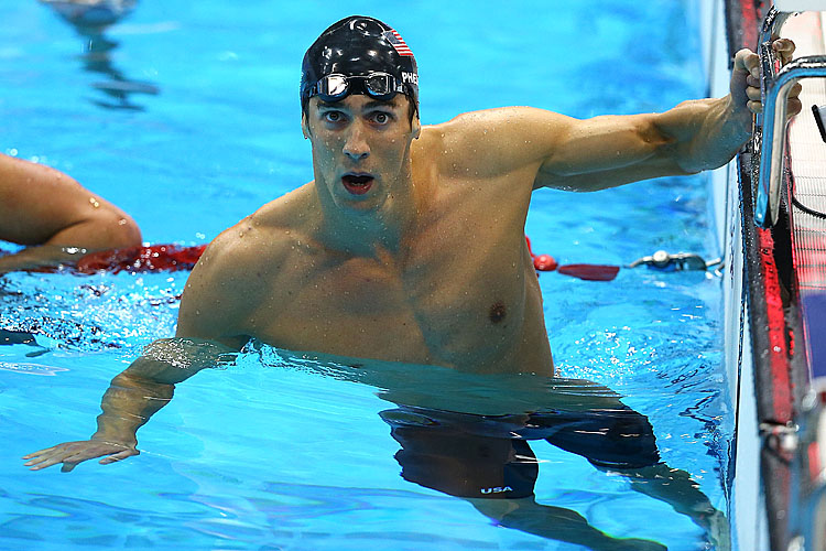 Michael Phelps of the United States looks at the scoreboard to see his winning time in the Men's 200m Individual Medley final on Day 6 of the London 2012 Olympic Games. (Al Bello/Getty Images)