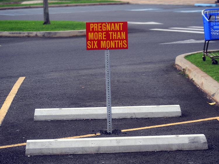 A parking sign warns a restriction for pregnant women at the U.S. Marine Base Hawaii Kailua. (Tim Sloan/AFP/Getty Images)