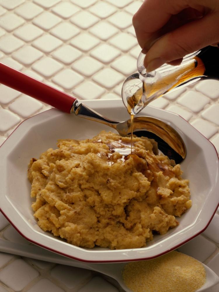 One of the many ways to eat polenta. In this version herbs, extra virgin olive oil and parmesan cheese make for a tangy, delicious treat.  (photos.com)