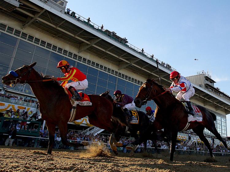 Lookin at Lucky, First Dude and Jackson Bend cross the finish line in the Preakness. (Matthew Stockman/Getty Images)