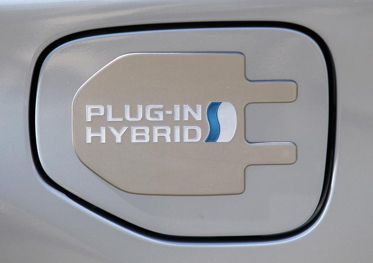 HYBRID POWER: A logo is displayed on a Toyota Prius plug-in hybrid in San Francisco. Toyota Motor Corp. is planning to expand its Prius lineup of hybrid vehicles. (Justin Sullivan/Getty Images)