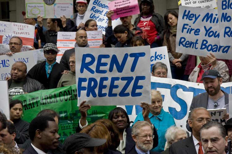 Tenants and officials protest  against rent increases in front of City Hall. (The Epoch Times)