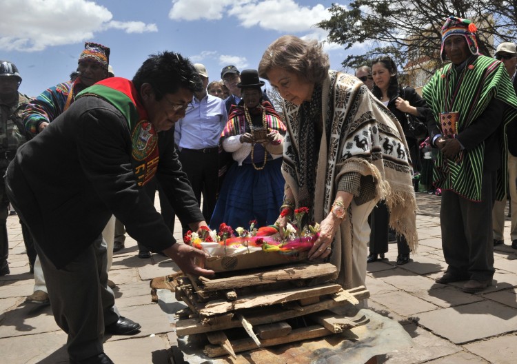 Queen Sofia of Spain (C) takes part in an indigenous ritual during a five-day official visit to the archaeological site of Tiwanaku in Bolivia Wednesday. (Aizar Raldes/AFP/Getty Images)