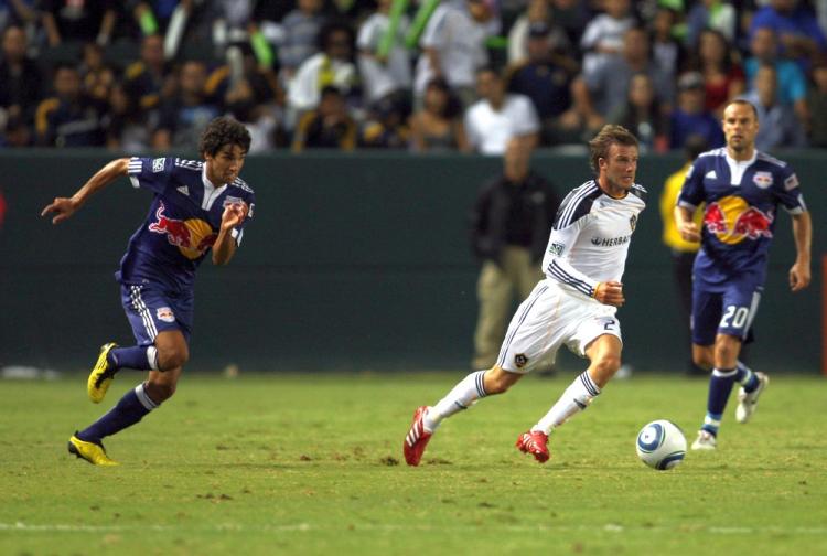 Mehdi Ballouchi (L) of the New York Red Bulls tracks David Beckham of the L.A. Galaxy. (Victor Decolongon/Getty Images)