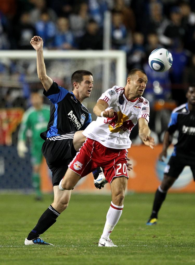New York's Joel Lindpere tangles with San Jose's Sam Cronin in MLS Playoff action on Saturday night.