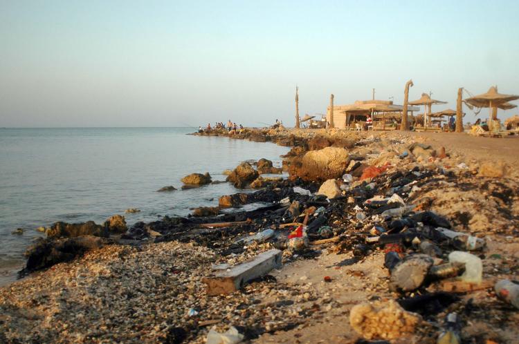 Oil is washed up along the public beach at the Red Sea resort of Hurghada, in southern Egypt, on June 23, which attacks hundreds of thousands of tourists all year round. Egypt's government has said that it is considering reducing drilling.   (STR/Getty Images)