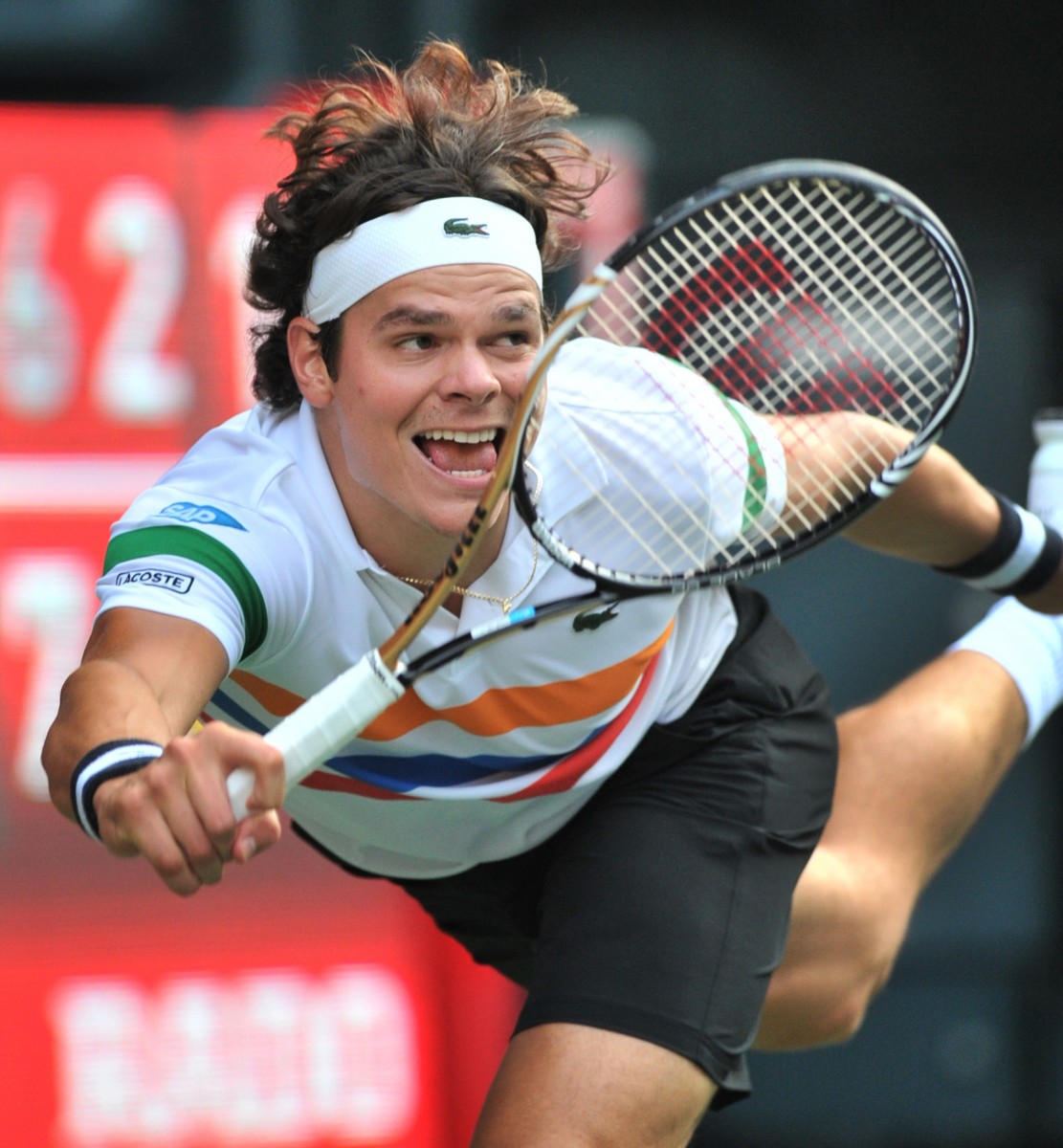 Canada's Milos Raonic returns a shot in the Japan Open tennis final on Sunday. He reached a career-high ranking of No. 13 in the world by reaching the final. (Kazuhiro Nogi/AFP/GettyImages)