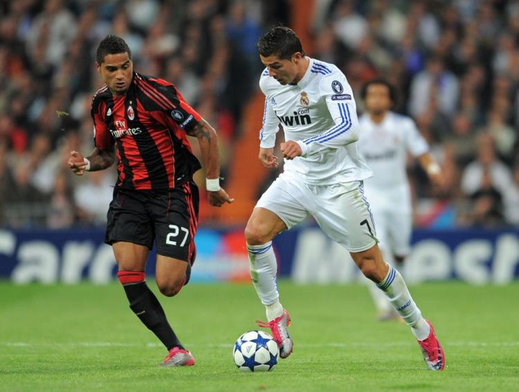 Real Madrid's Cristiano Ronaldo (right) terrorized AC Milan's aging squad in Tuesday's Champions League action. (Jasper Juinen/Getty Images)