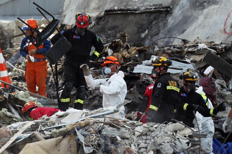 Rescue workers clear out remains from the CTV building on March 1, 2011 in Christchurch, New Zealand. The quake, which was an aftershock of a 7.1 magnitude quake that struck the South Island city on September 4, 2010, has seen damage and fatalities far exceeding those of the original. (Hannah Johnston/Getty Images)