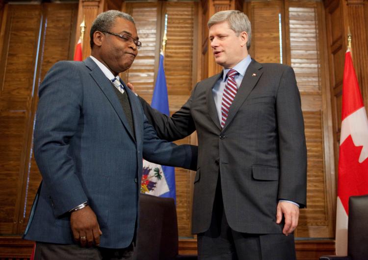 Prime Minister Stephen Harper discusses relief efforts in Haiti with Jean-Max Bellerive, Prime Minister of Haiti, on Jan. 24 in Ottawa. (Jason Ransom)