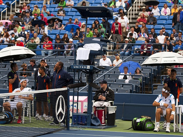 RAIN DELAY: Andy Roddick and David Ferrer wait out a rain delay on Wednesday, September 7 in Louis Armstrong Stadium in Flushing, NY. The players felt that conditions were unsafe at the time and that they should have never been brought on court. They are pondering forming a union to help have their voices heard from now on.  (Don Emmert/Getty Images)