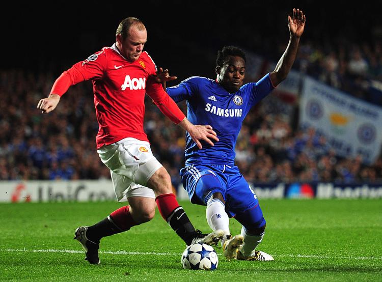 Wayne Rooney of Manchester United battles with Michael Essien of Chelsea during the UEFA Champions League quarter final first leg match between Chelsea and Manchester United. (Shaun Botterill/Getty Images)