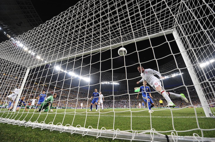 England's Wayne Rooney heads home the game's only goal against Ukraine on Tuesday night. (Carl de Souza/AFP/GettyImages)