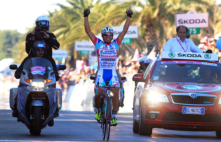 Miguel Rubiano celebrates crossing the finish line of the Stage Six of the Giro d'Italia. (Luk Beines/AFP/GettyImages)