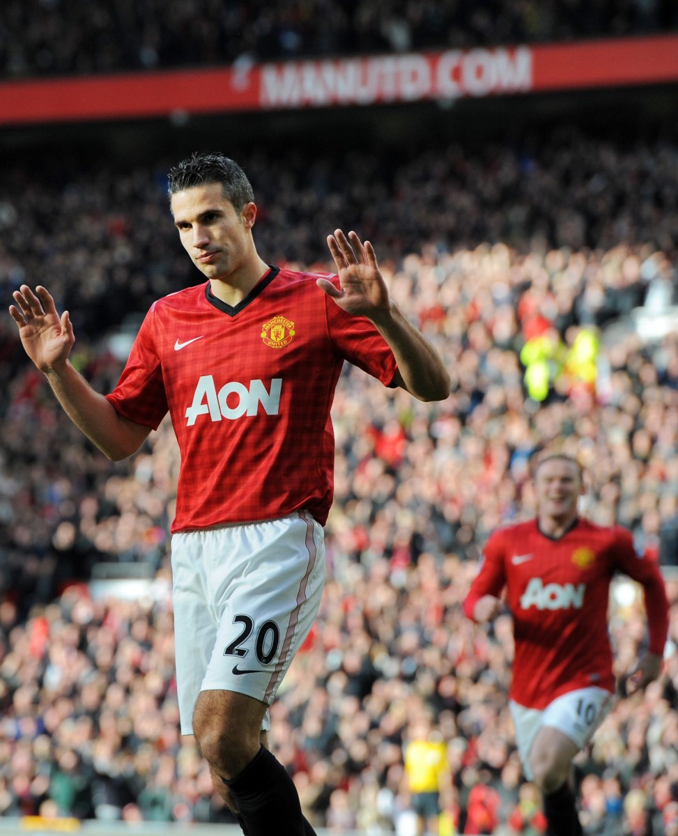 Robin van Persie didn't show much emotion after scoring in the third minute against his former club Arsenal on Saturday at Old Trafford. (Andrew Yates, Paul Ellis/AFP/Getty Images) 