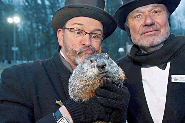 GLORIOUS DAY: Storm chaser Ed Jekielek (R) and Ben Hughes (L), one of Phil's handlers, bask in the prognosticating rodent's glory. (Jan Jekielek/The Epoch Times)