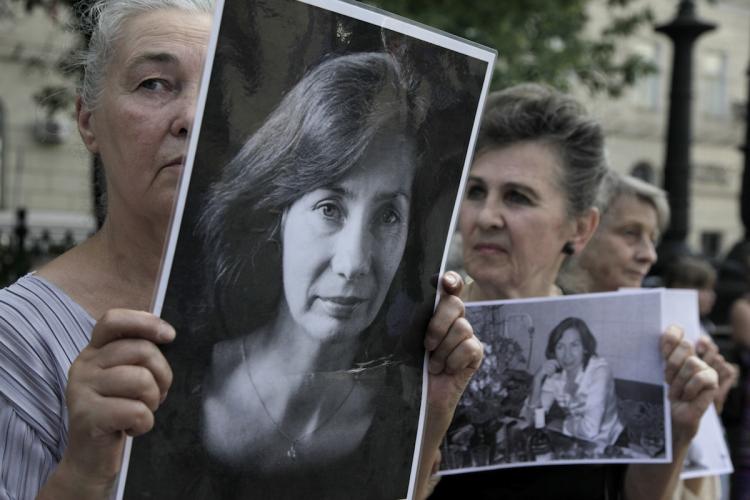 SLAIN HERO: Russian activists hold portraits of slain human rights activist Natalia Estemirova in Moscow on July 15, during a rally to mark the one-year anniversary of her killing. (Oxana Onipko/Getty Images)