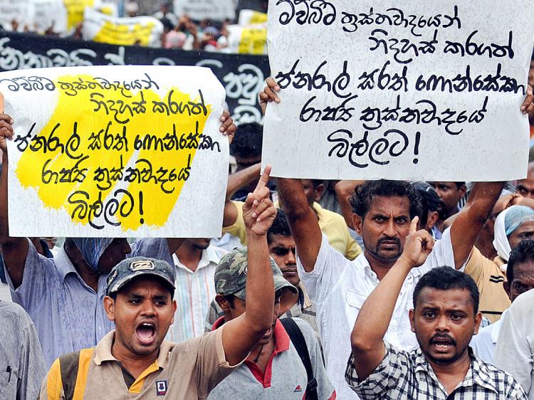 Sri Lanka's opposition People's Liberation Front supporters protest in Colombo on Feb. 16. The demonstrators called for the immediate release of former army chief and defeated presidential candidate General Sarath Fonseka. (Lakruwan Wanniarachchi/AFP/Getty Images)