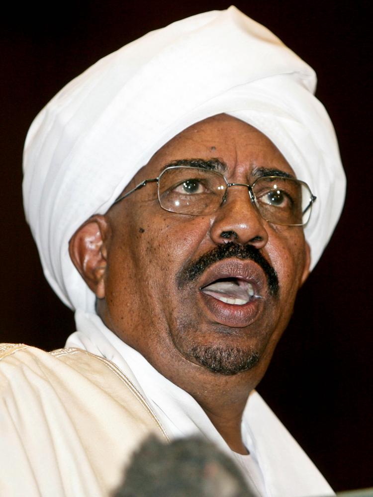 GENOCIDE CHARGES: Sudanese President Omar al-Bashir gives a speech during in Parliament in Khartoum, Sudan, on May 27. On Monday, al-Bashir was charged with genocide by the International Criminal Court.  (Ashraf Shazly/Getty Images)